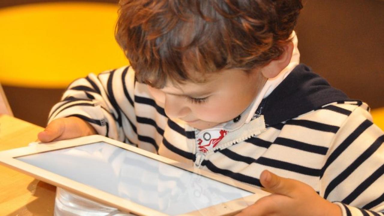 Child holding an iPad