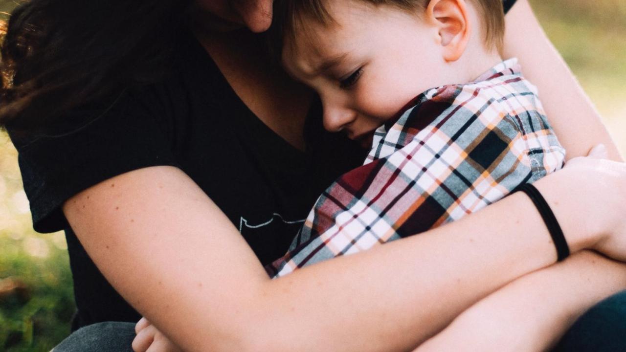 Mom holding child