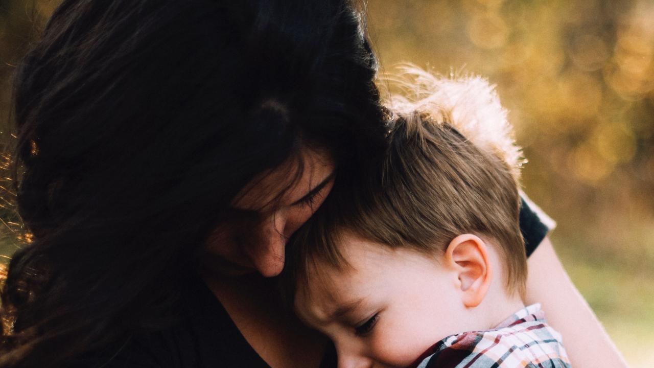 Mom holding child