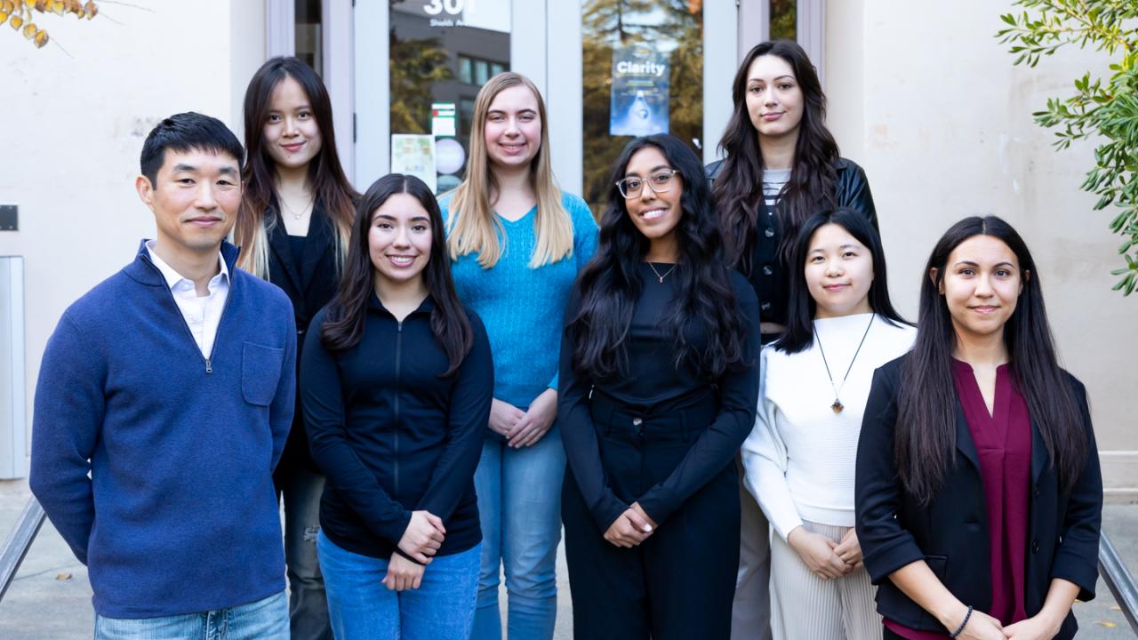 Photo of Lab team members standing in front of Hart Hall